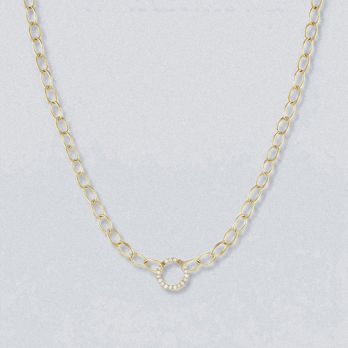 Oval chain necklace in solid yellow gold with a diamond centre ring