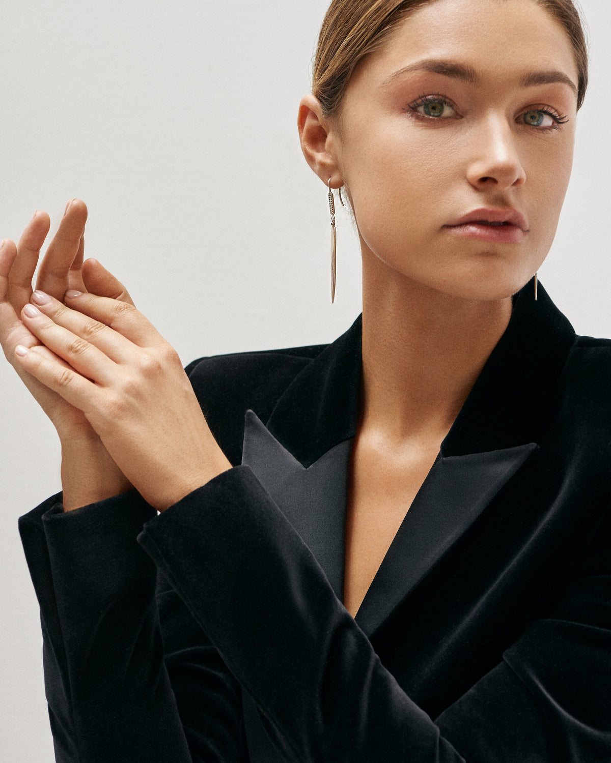 Dagger Hook Earrings, photographed on a model