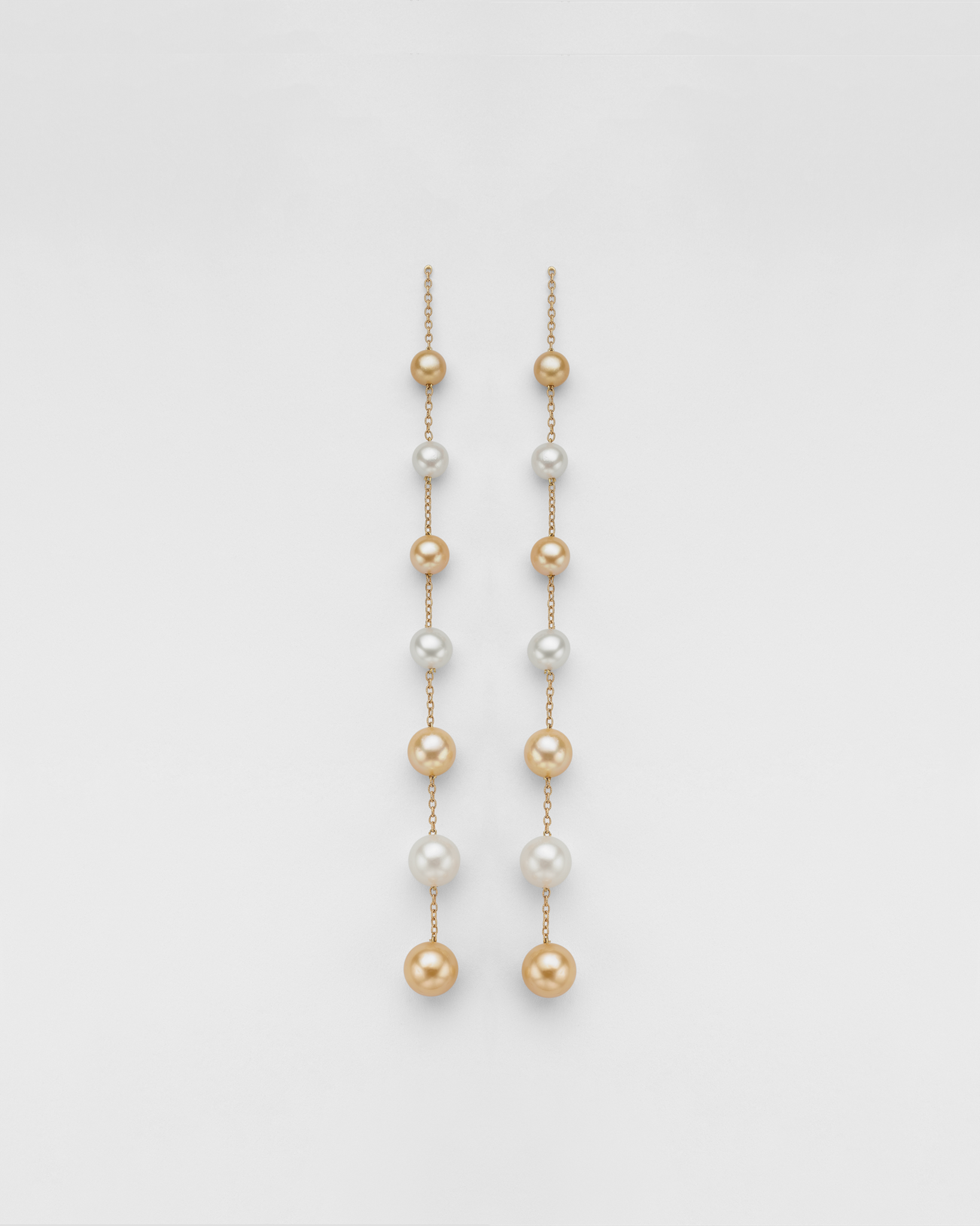 GOLDEN IVORY PEARL SHOULDER DUSTER EARRINGS